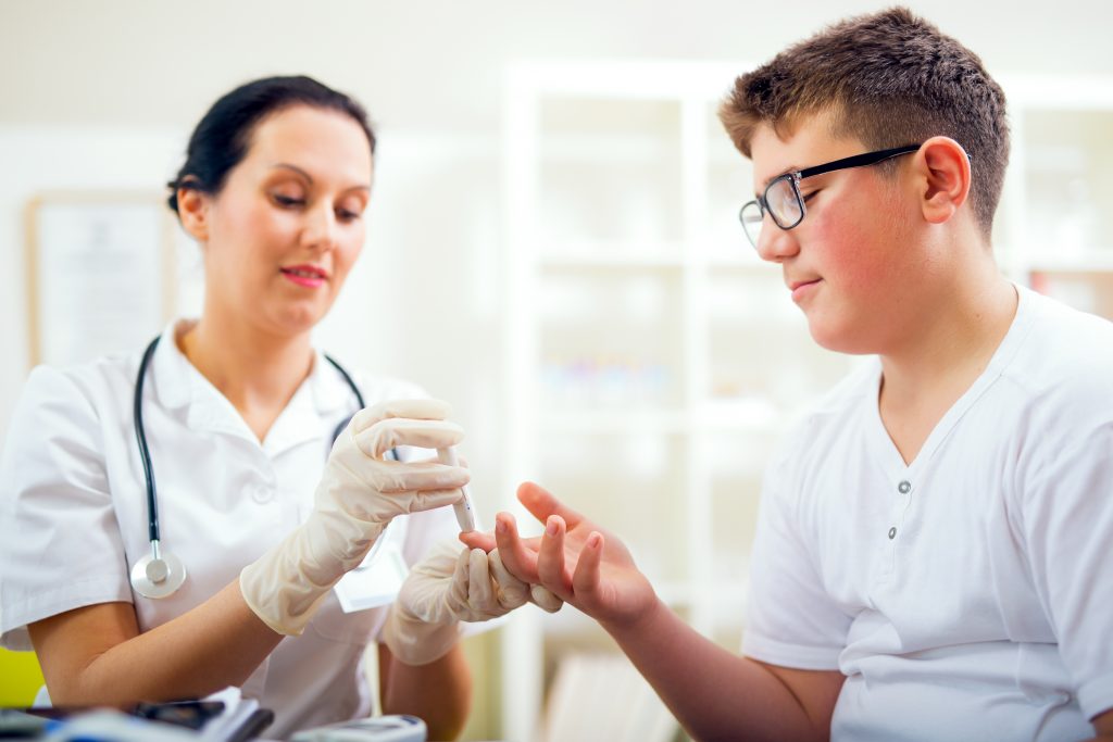 Patient Having His Blood Sugar Checked