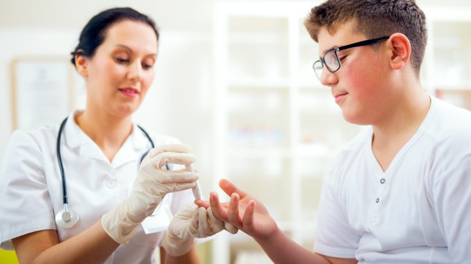 Patient Having His Blood Sugar Checked