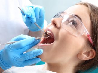 Overview of dentist working on a patient