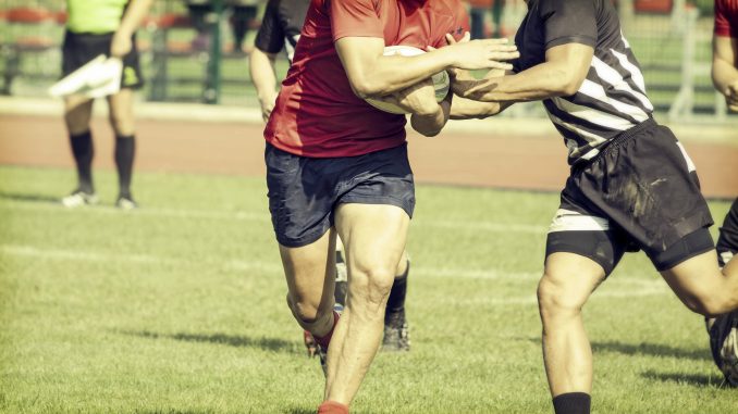 Men Playing Rugby