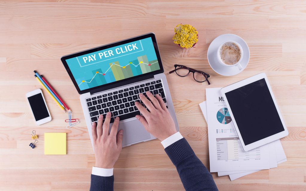 A pair of hands working on a business' web traffic