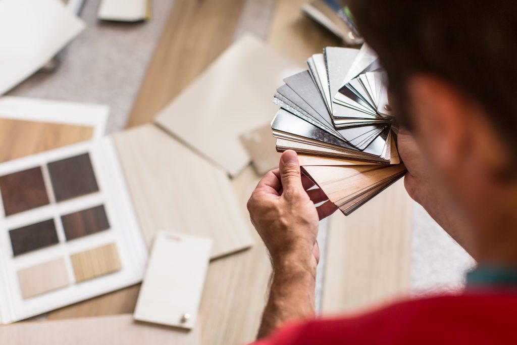 Man choosing from a variety of flooring