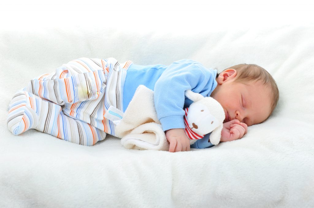 Baby Sleeping On White Blanket