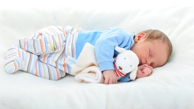 Baby Sleeping On White Blanket