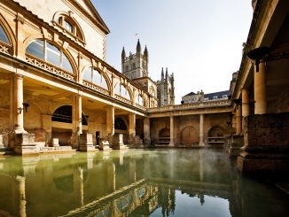 Roman Baths with Bath Abbey reflection in Bath, England
