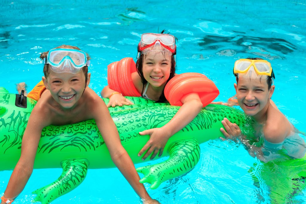 Some children swimming in a pool