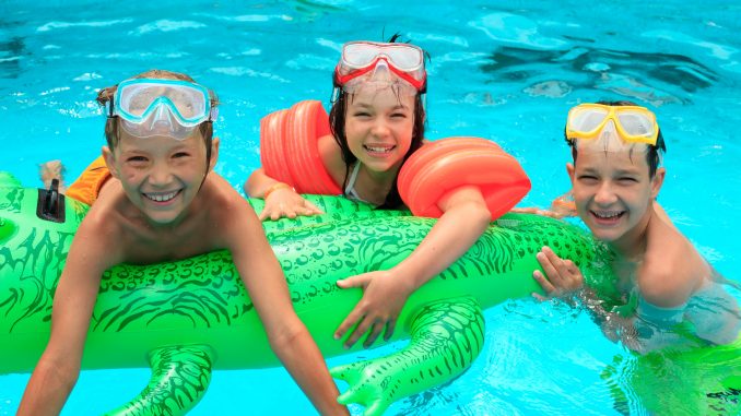 Some children swimming in a pool