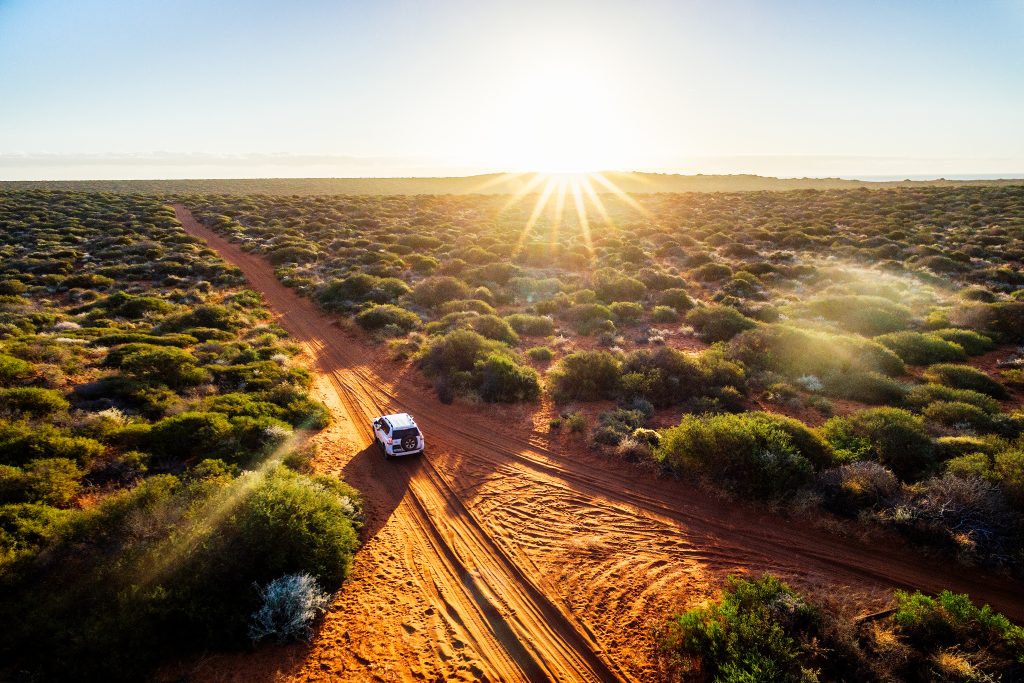 red sand unpaved road