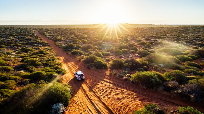 red sand unpaved road