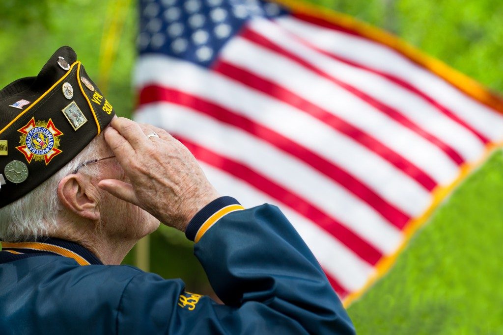 military veteran saluting the flag