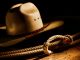 American West rodeo cowboy lasso rope and white straw hat