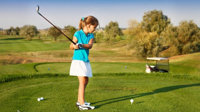 Girl playing golf