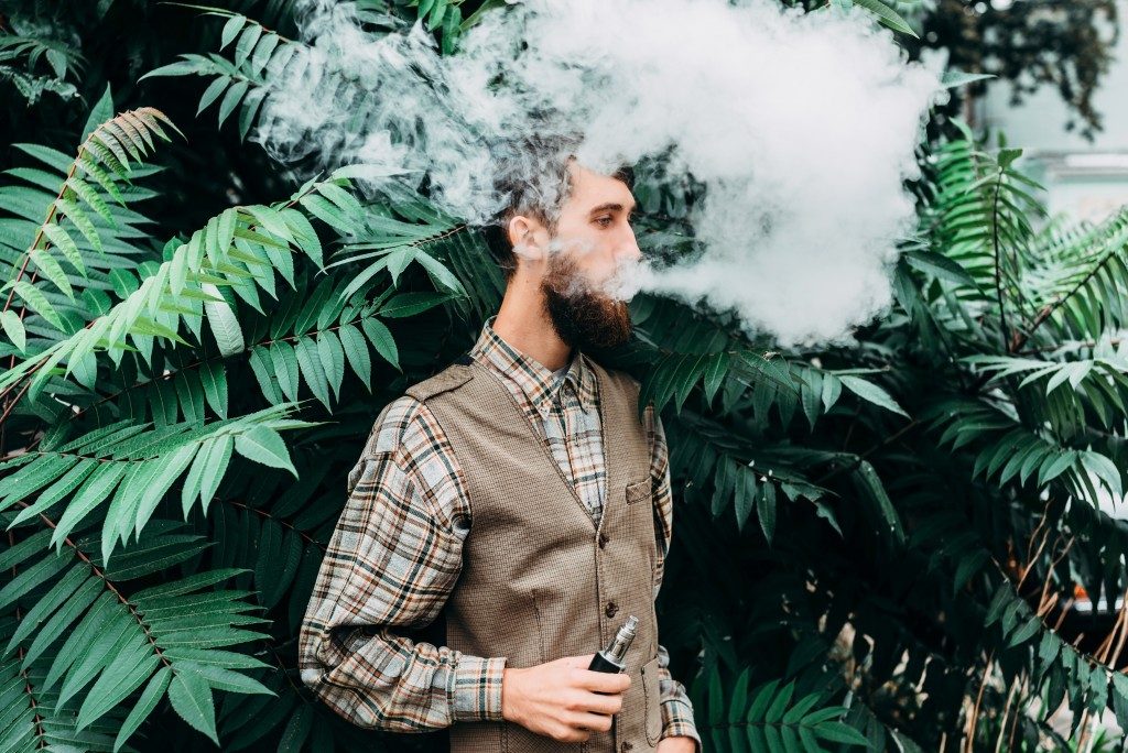 a man using an electronic cigarette