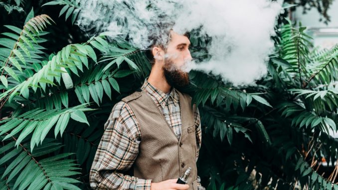 a man using an electronic cigarette