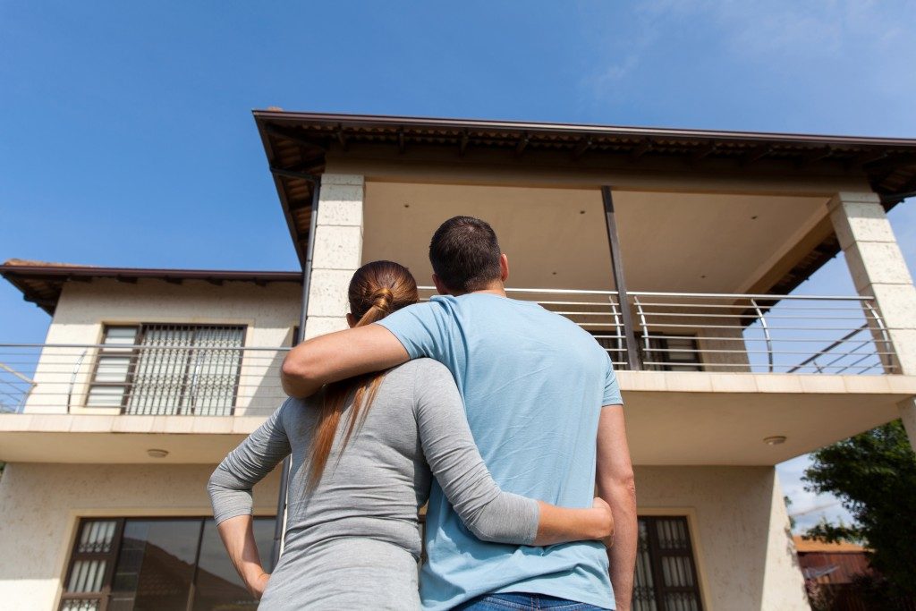 Couple looking at house