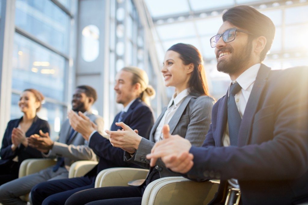 Row of business people in a company event