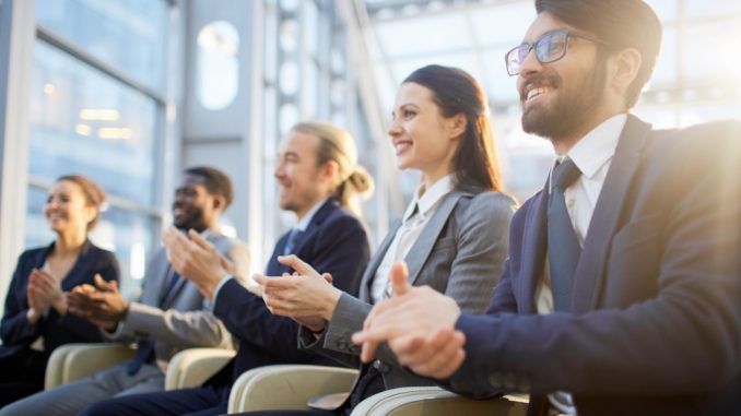 Row of business people in a company event