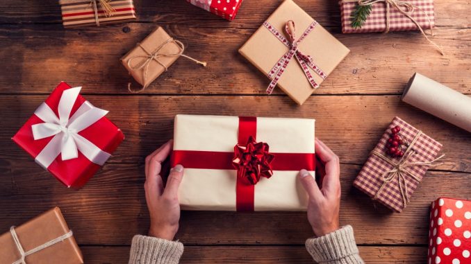 Man holding christmas present