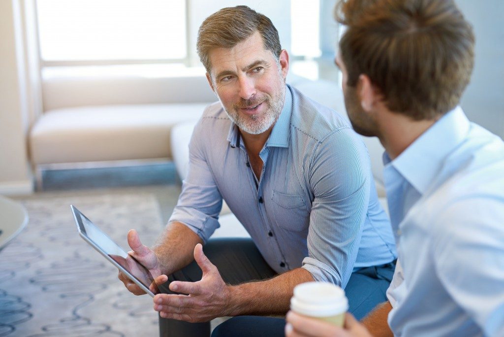 Manager mentoring his associate