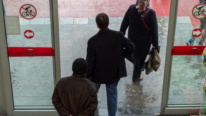 people exiting glass sliding door