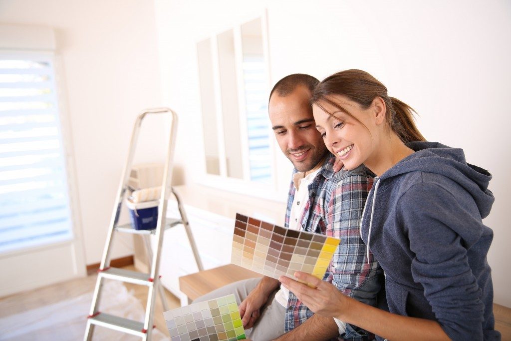 Couple choosing a new wall color