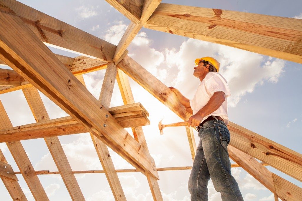 Man building roof