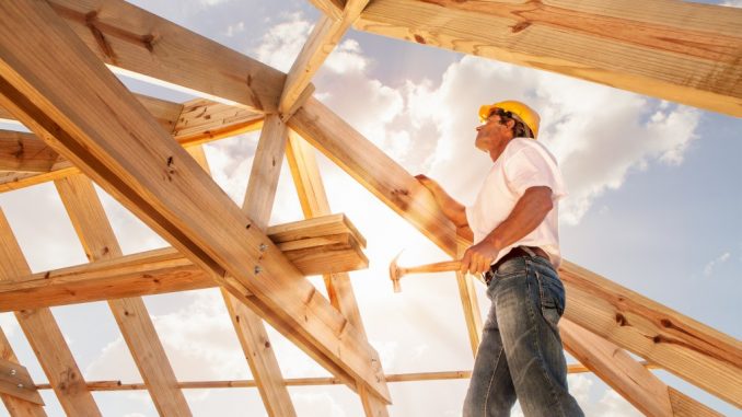 Man building roof