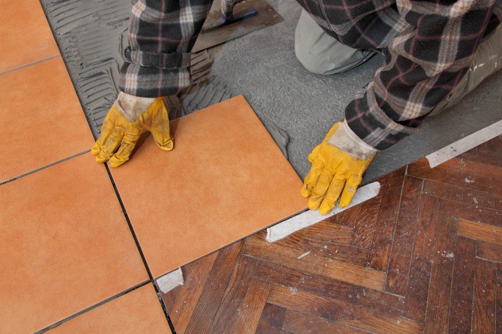 man placing tiles