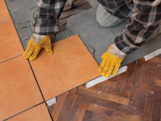 man placing tiles