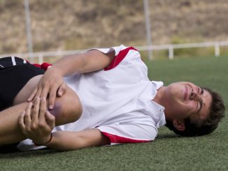 Football player with knee injury