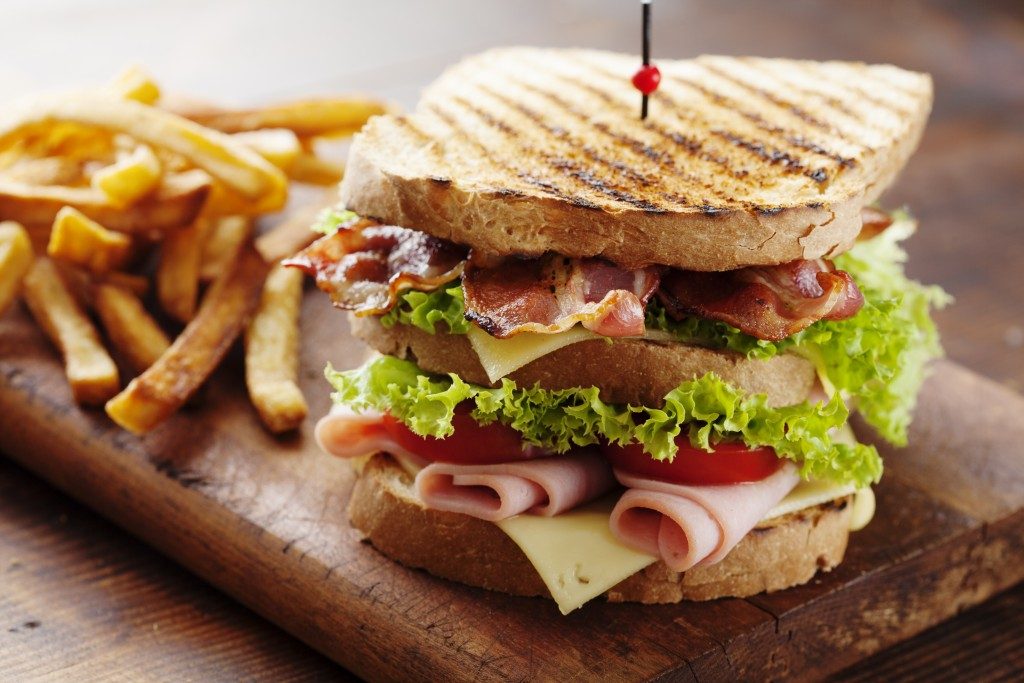 A club sandwich with fries