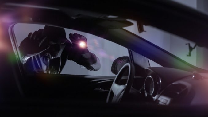 robber shining light inside the car