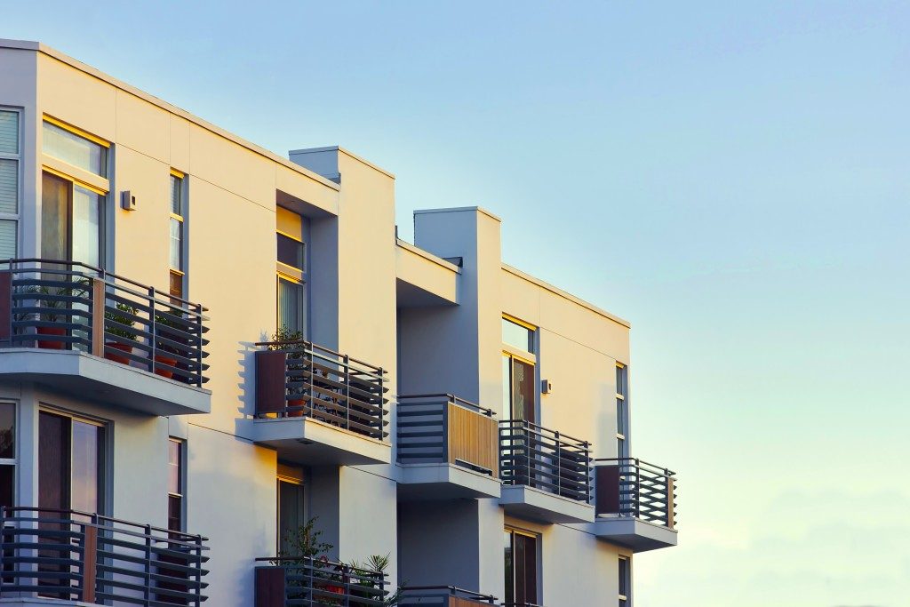 Modern apartment balcony at sunset.