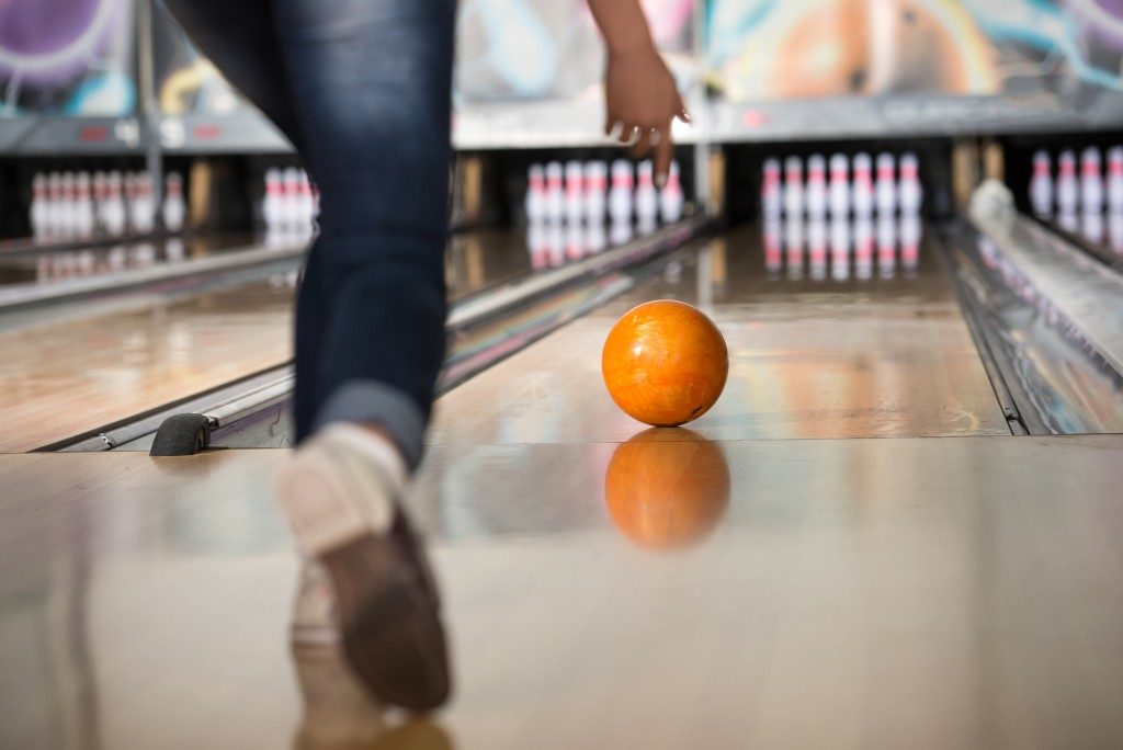 bowling, orange ball rolling 