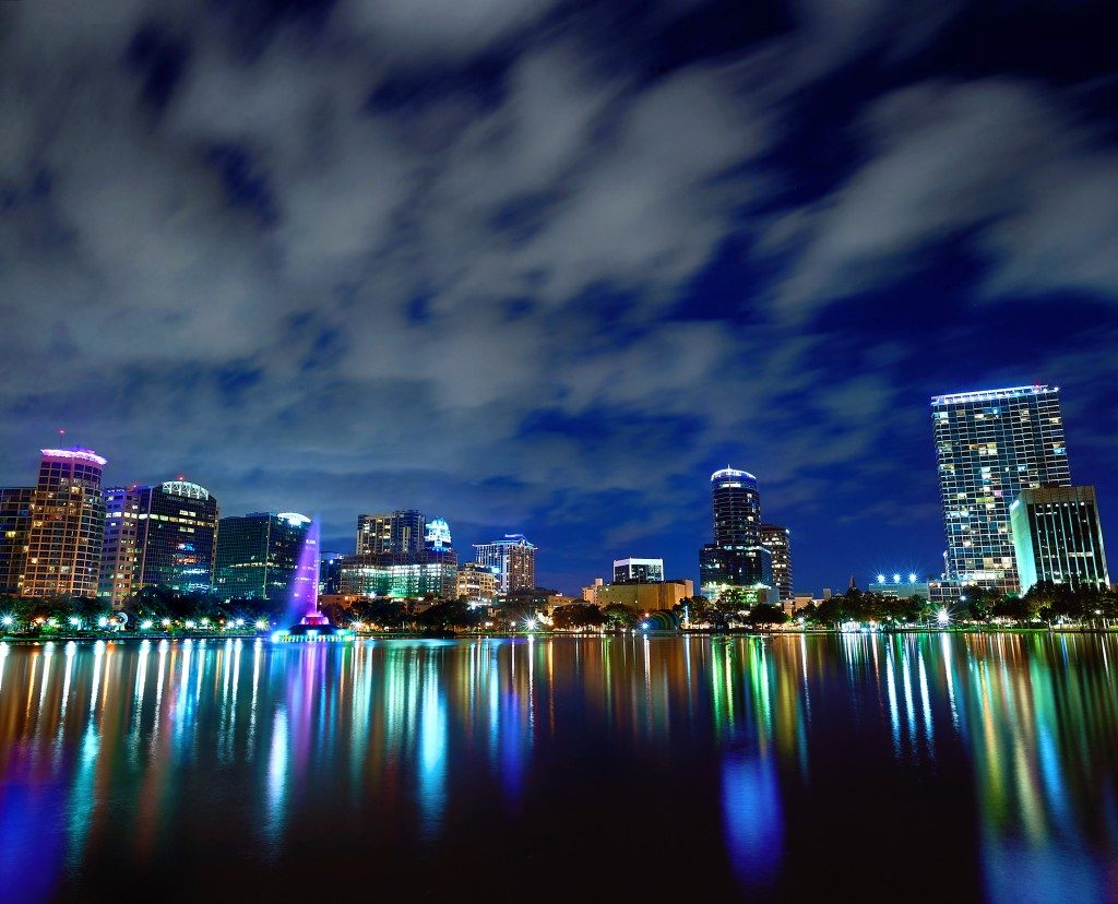 city lights reflecting on the lake at night