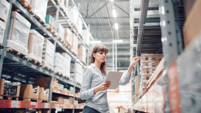 woman checking inventory in the warehouse