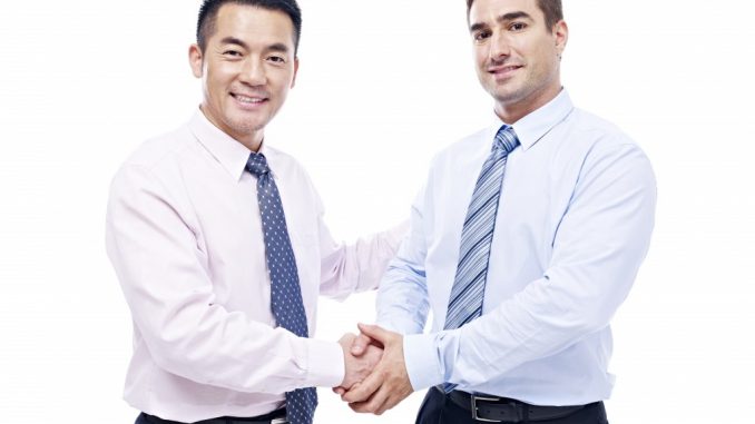 two businessmen shaking hands