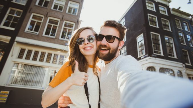 tourist couple taking a selfie