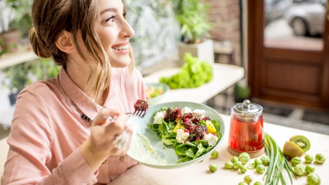 woman eating salad