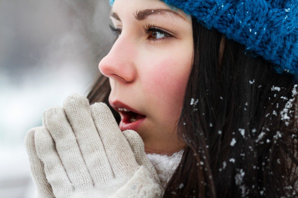 Female making herself warm during winter