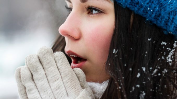 Female making herself warm during winter