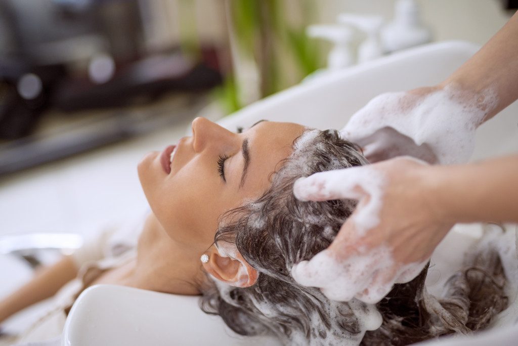 woman having her hair wash in a salon