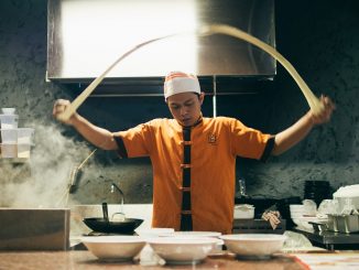 asian chef making noodles