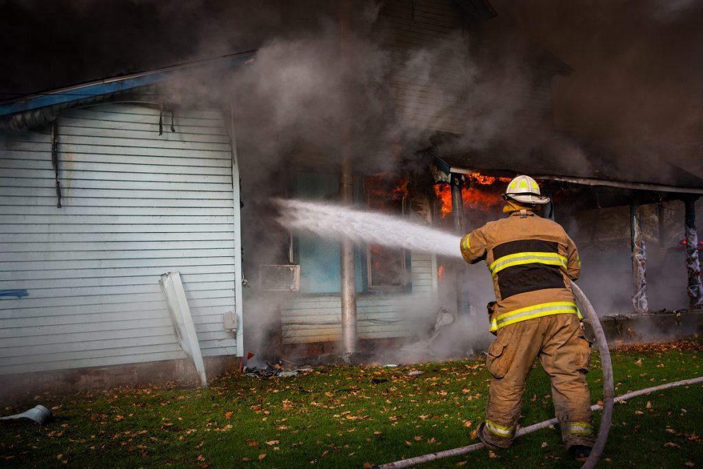 firefighter putting out fire