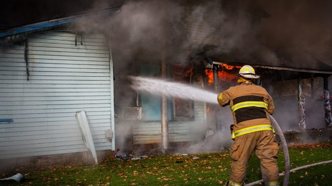 firefighter putting out fire