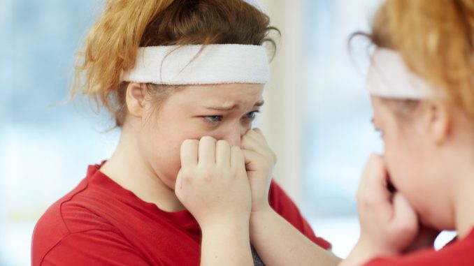 crying infront of the mirror after exercise