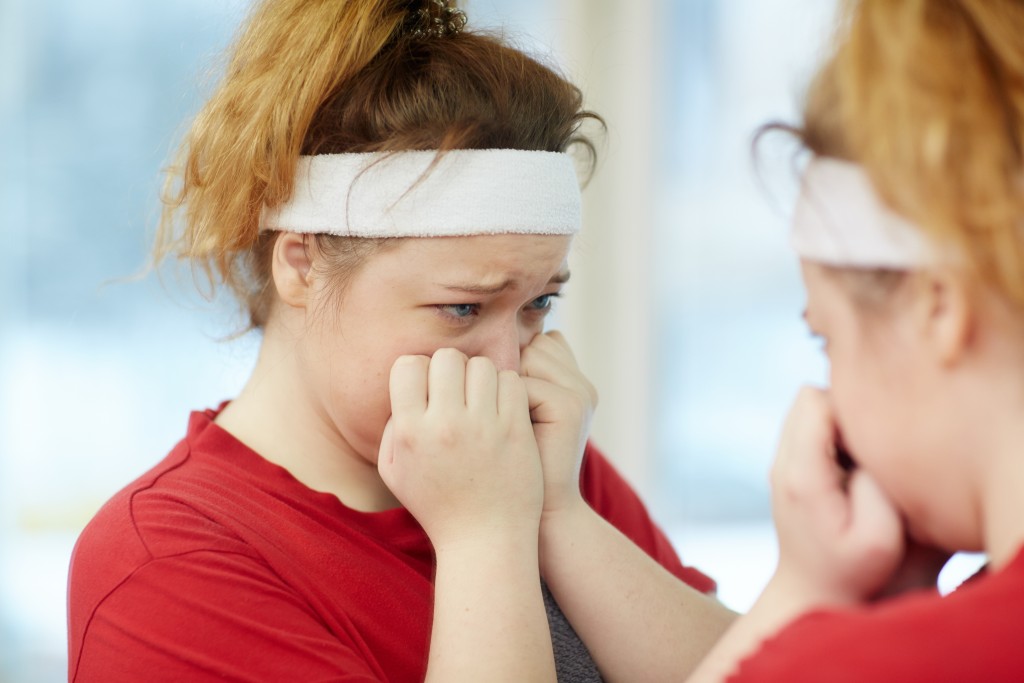 crying infront of the mirror after exercise