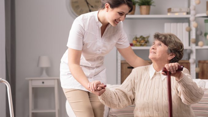 woman assisting elder woman