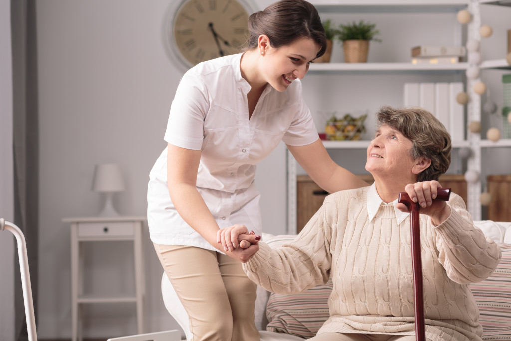 woman assisting elder woman