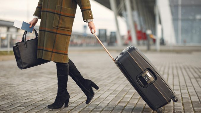 woman carrying luggage